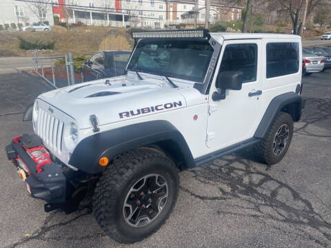 2014 Jeep Wrangler for sale at Premier Automart in Milford MA