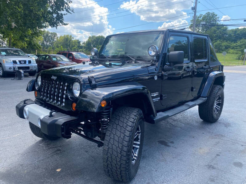 Used 2011 Jeep Wrangler Unlimited Sahara with VIN 1J4BA5H12BL516257 for sale in Saint Louis, MO