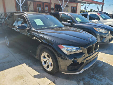 2015 BMW X1 for sale at E and M Auto Sales in Bloomington CA