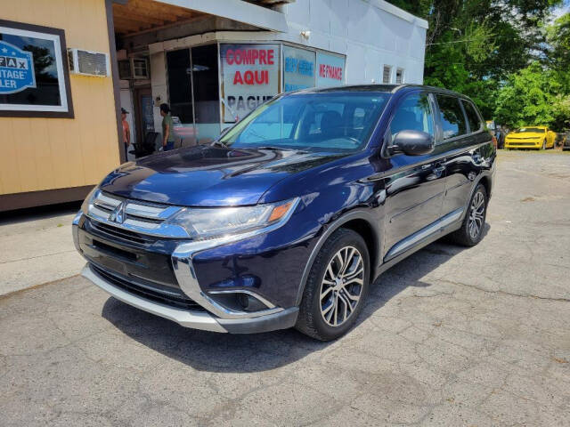 2016 Mitsubishi Outlander for sale at DAGO'S AUTO SALES LLC in Dalton, GA