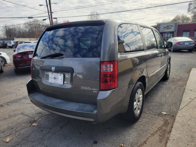 2010 Dodge Grand Caravan for sale at DAGO'S AUTO SALES LLC in Dalton, GA