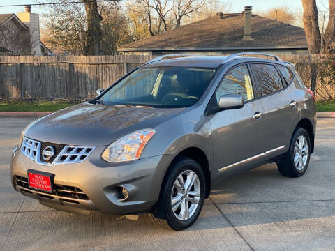 2013 Nissan Rogue for sale at KM Motors LLC in Houston TX
