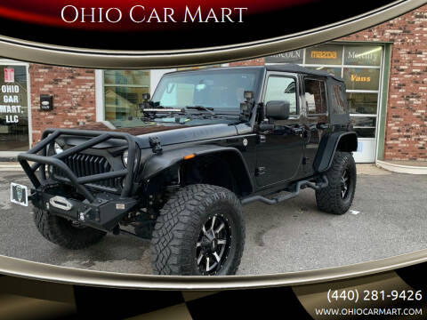 2016 Jeep Wrangler Unlimited for sale at Ohio Car Mart in Elyria OH