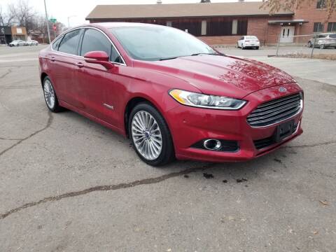 2013 Ford Fusion Hybrid for sale at KHAN'S AUTO LLC in Worland WY