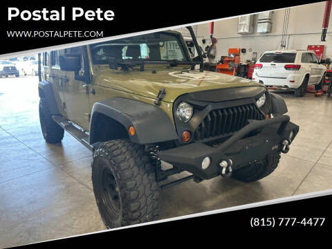 2013 Jeep Wrangler Unlimited for sale at Postal Pete in Galena IL