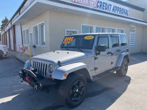 2013 Jeep Wrangler Unlimited for sale at Suarez Auto Sales in Port Huron MI
