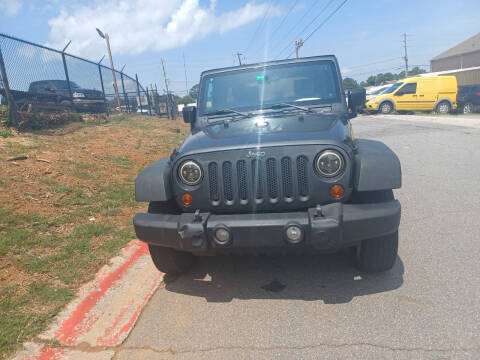 2010 Jeep Wrangler Unlimited for sale at Star Car in Woodstock GA