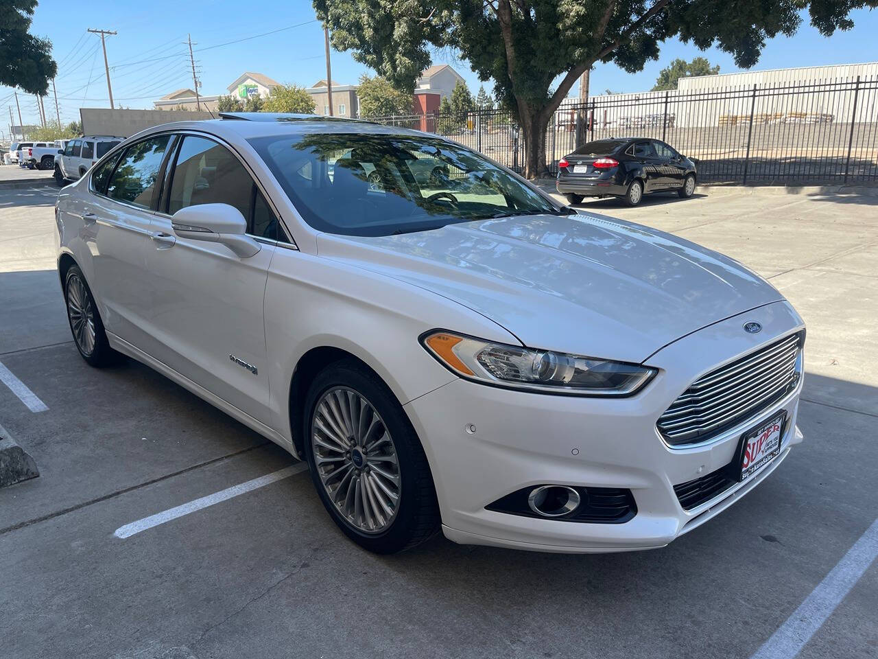 2014 Ford Fusion Hybrid for sale at Super Auto Sales Modesto in Modesto, CA