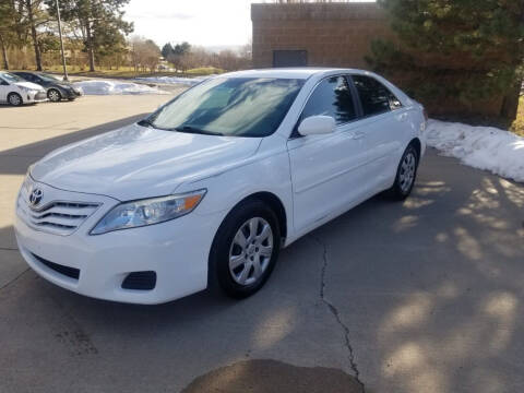 2011 Toyota Camry for sale at QUEST MOTORS in Englewood CO