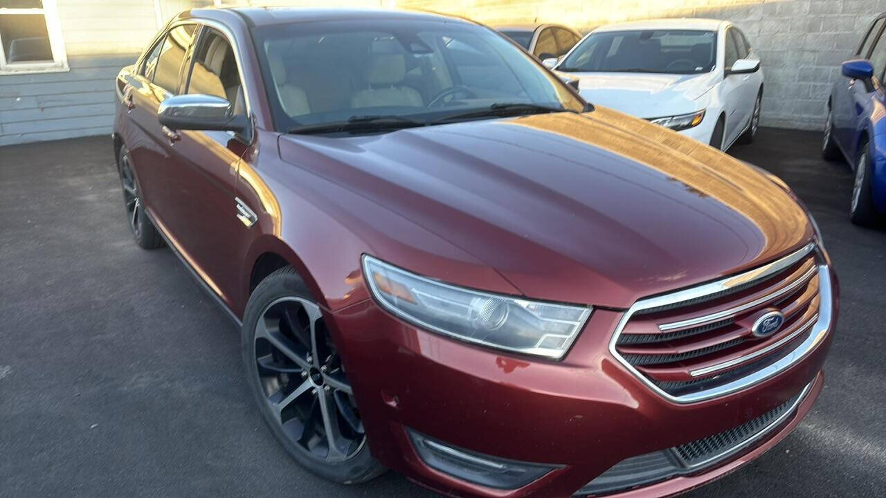 2014 Ford Taurus for sale at Ganda Auto Sales in Denver, CO