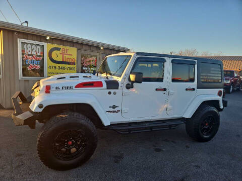 2013 Jeep Wrangler Unlimited for sale at CarTime in Rogers AR