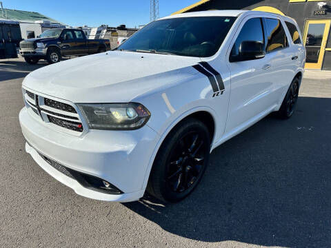 2014 Dodge Durango for sale at BELOW BOOK AUTO SALES in Idaho Falls ID