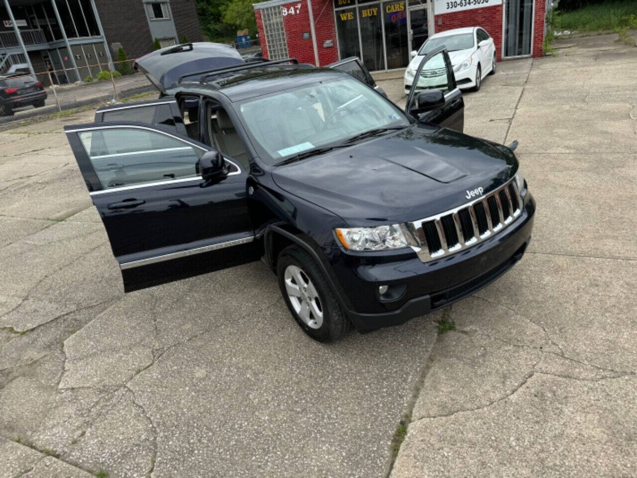 2011 Jeep Grand Cherokee for sale at First Class Auto Mall in Akron, OH