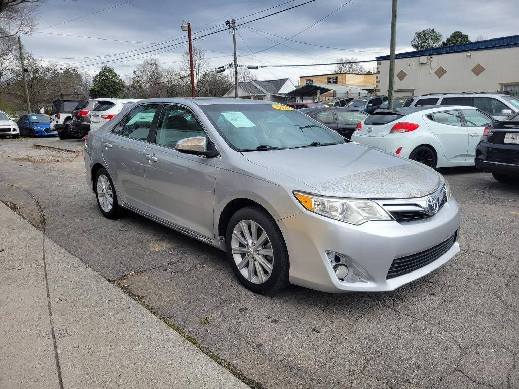 2012 Toyota Camry for sale at DAGO'S AUTO SALES LLC in Dalton, GA