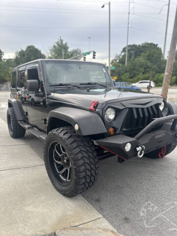 2011 Jeep Wrangler Unlimited for sale at Alpha Auto Center II in Worcester MA