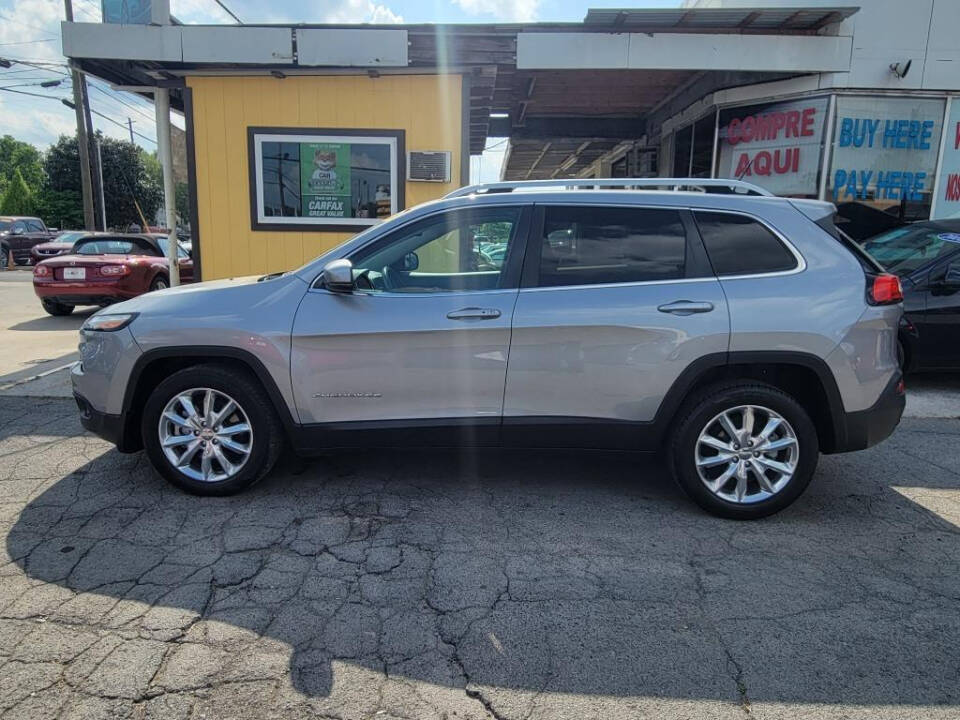 2014 Jeep Cherokee for sale at DAGO'S AUTO SALES LLC in Dalton, GA