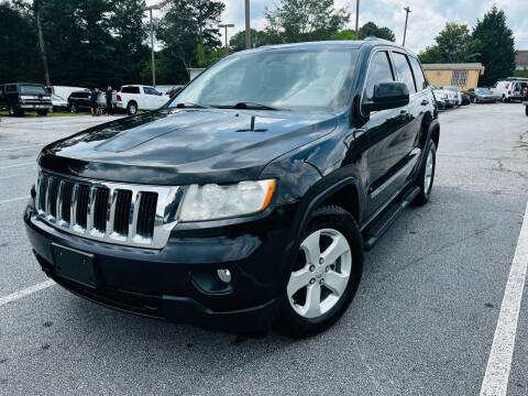 2012 Jeep Grand Cherokee for sale at Luxury Cars of Atlanta in Snellville GA