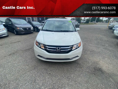 2014 Honda Odyssey for sale at Castle Cars Inc. in Lansing MI