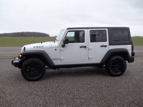 2015 Jeep Wrangler Unlimited for sale at Howe's Auto Sales in Grelton OH