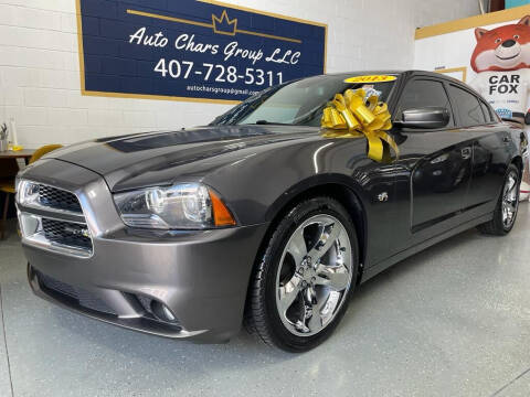 2013 Dodge Charger for sale at Auto Chars Group LLC in Orlando FL