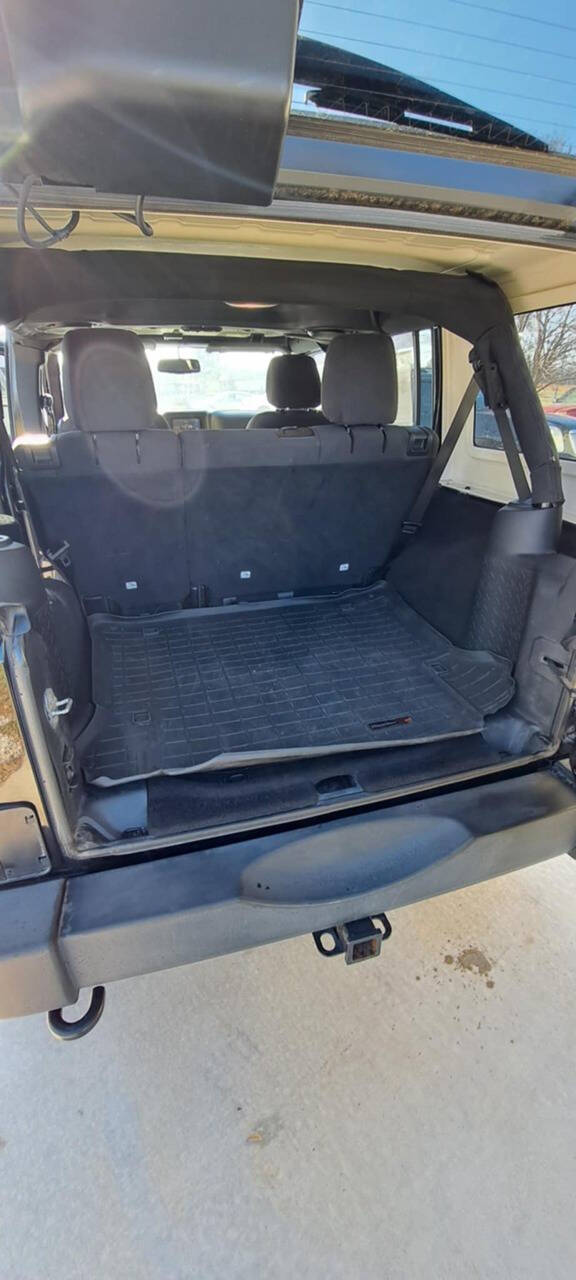 2014 Jeep Wrangler Unlimited for sale at CORNMAN AUTO LLC in Kirksville, MO