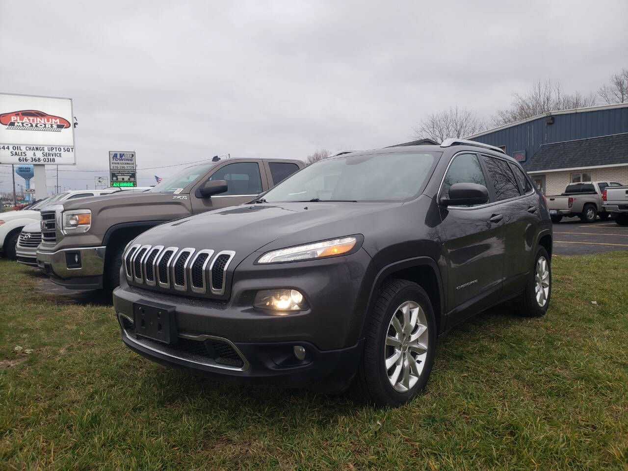 2015 Jeep Cherokee for sale at Platinum Motors in Holland, MI