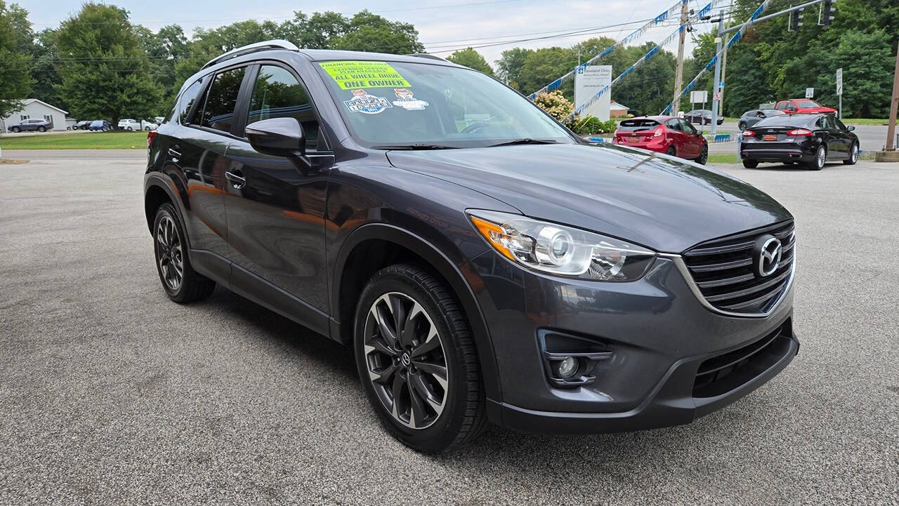 2016 Mazda CX-5 for sale at North Ridge Auto Center LLC in Madison, OH