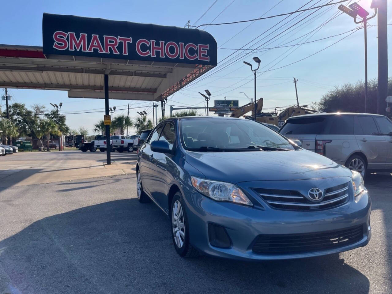 2013 Toyota Corolla for sale at SMART CHOICE AUTO in Pasadena, TX