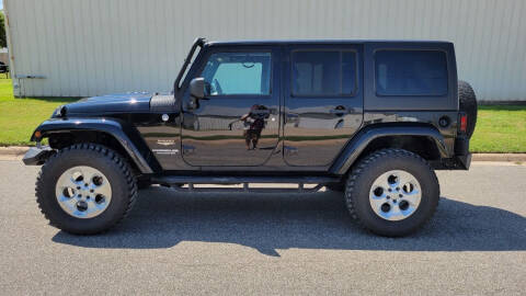 2014 Jeep Wrangler Unlimited for sale at TNK Autos in Inman KS
