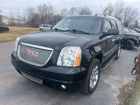 2012 GMC Yukon XL for sale at HEDGES USED CARS in Carleton MI