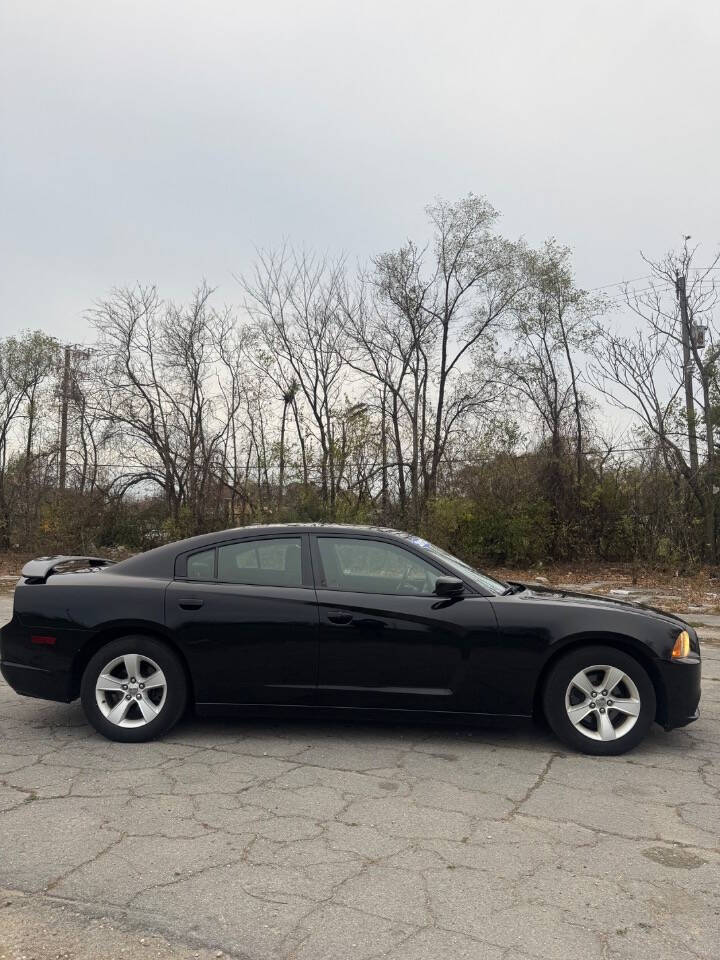 2012 Dodge Charger for sale at H & H AUTO GROUP in Detroit, MI