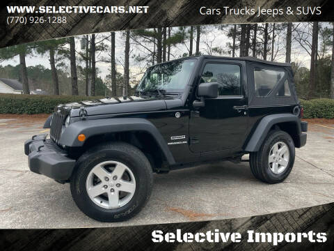 2015 Jeep Wrangler for sale at Selective Imports in Woodstock GA