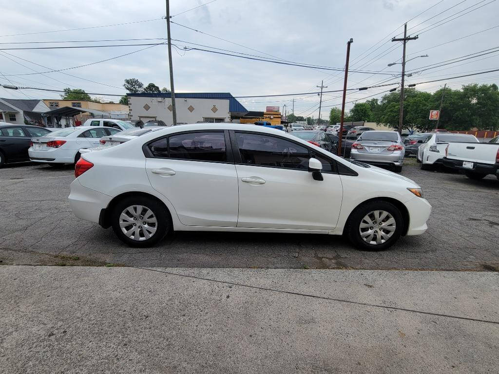 2012 Honda Civic for sale at DAGO'S AUTO SALES LLC in Dalton, GA