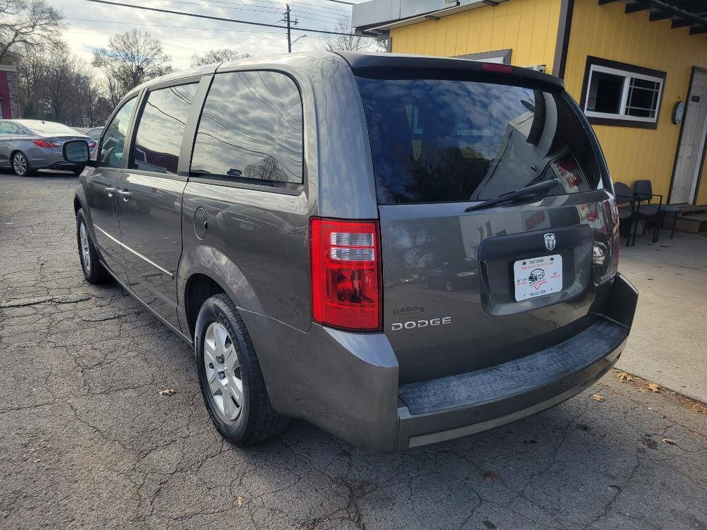 2010 Dodge Grand Caravan for sale at DAGO'S AUTO SALES LLC in Dalton, GA