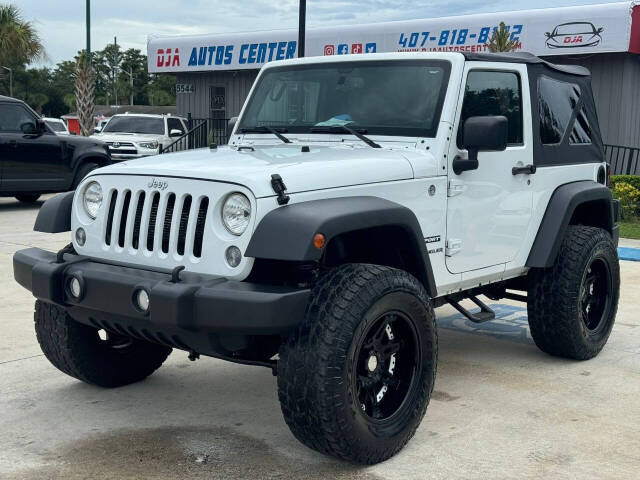 2014 Jeep Wrangler for sale at DJA Autos Center in Orlando, FL