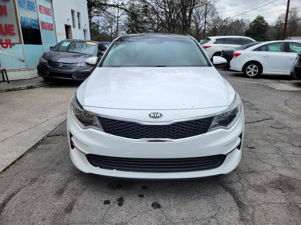 2016 Kia Optima for sale at DAGO'S AUTO SALES LLC in Dalton, GA