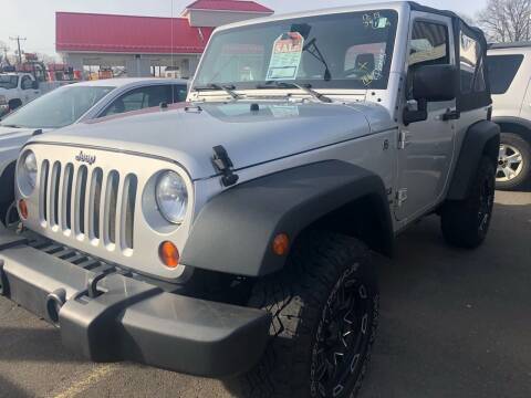 2012 Jeep Wrangler for sale at Story Brothers Auto in New Britain CT