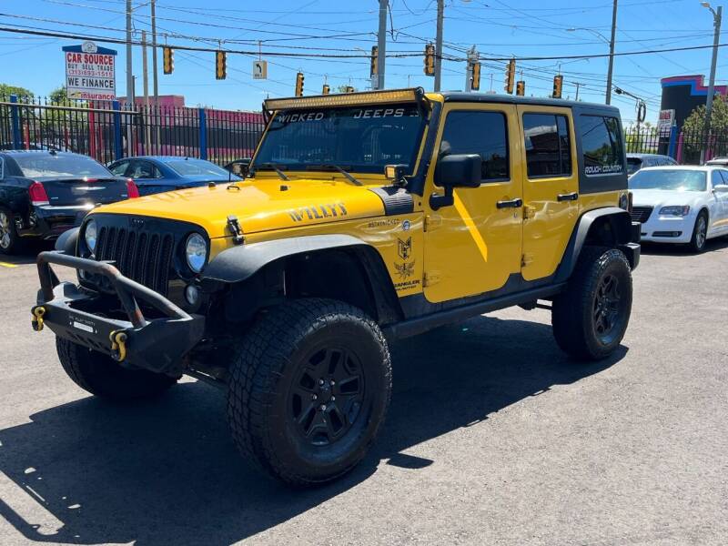 2015 Jeep Wrangler Unlimited for sale at SKYLINE AUTO in Detroit MI
