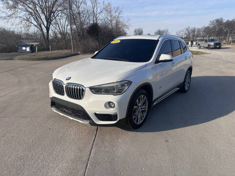 2016 BMW X1 for sale at ASHLAND AUTO SALES in Columbia MO