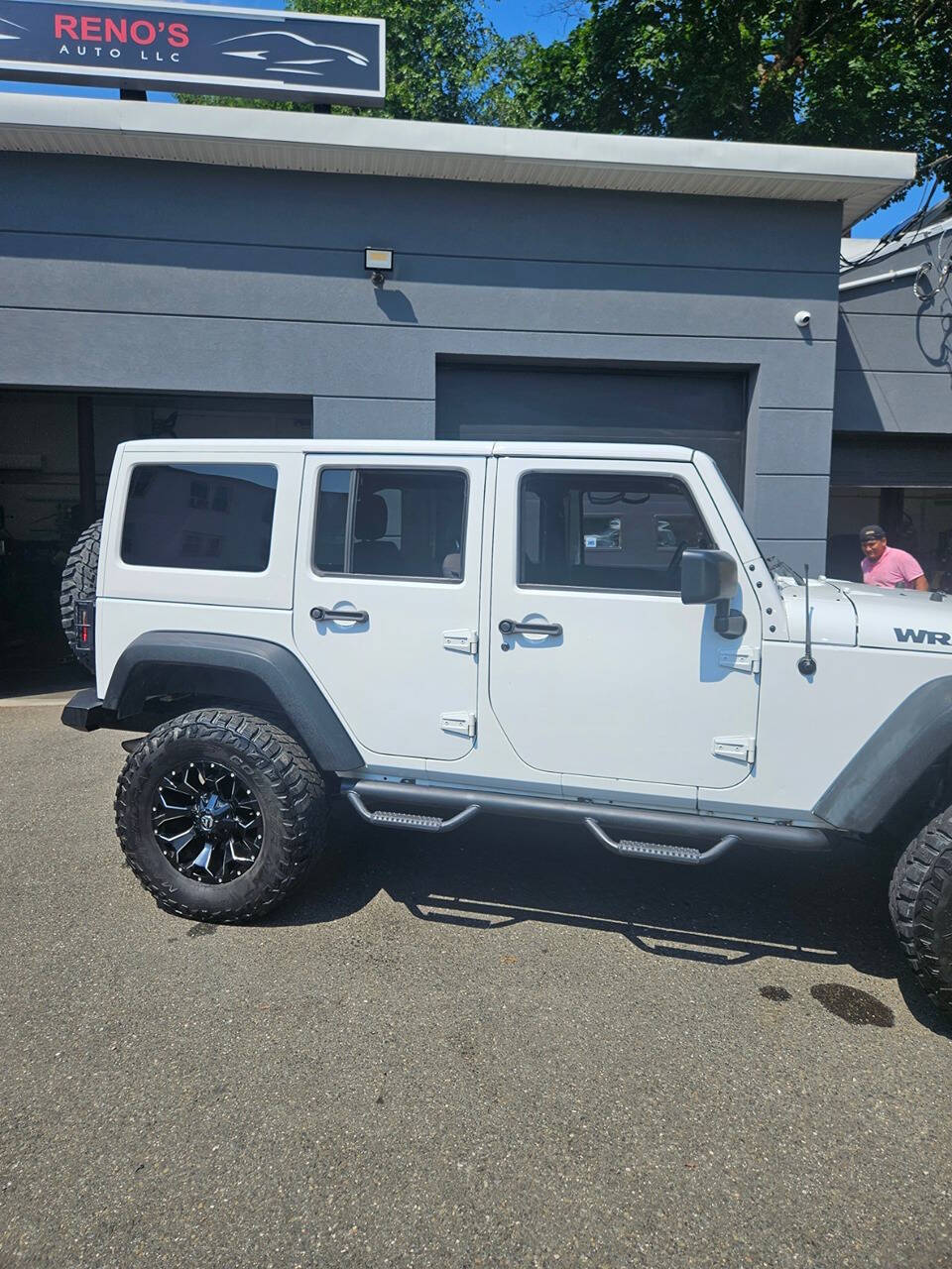 2016 Jeep Wrangler Unlimited for sale at RENOS AUTO SALES LLC in Waterbury, CT