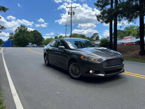 2014 Ford Fusion for sale at THE AUTO FINDERS in Durham NC