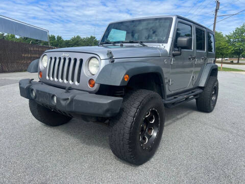 2013 Jeep Wrangler Unlimited for sale at Triple A's Motors in Greensboro NC