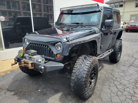2012 Jeep Wrangler for sale at Signature Auto Group in Massillon OH