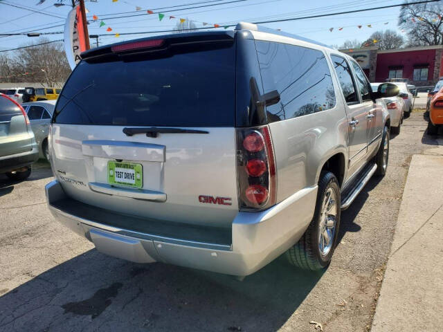 2011 GMC Yukon XL for sale at DAGO'S AUTO SALES LLC in Dalton, GA