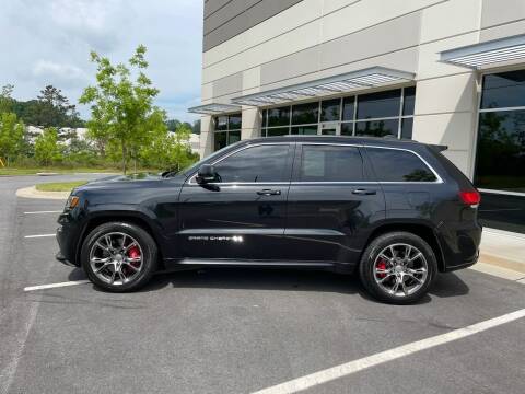 2014 Jeep Grand Cherokee for sale at Santana Luxury Motors LLC in Mableton GA