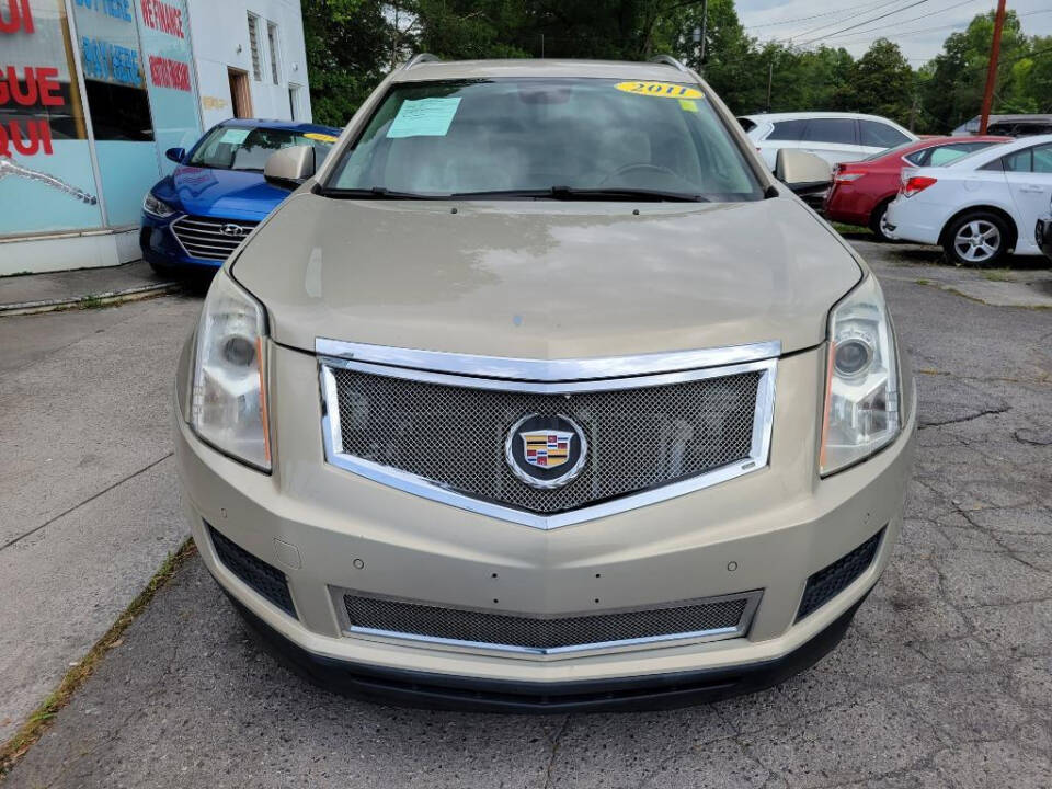 2011 Cadillac SRX for sale at DAGO'S AUTO SALES LLC in Dalton, GA