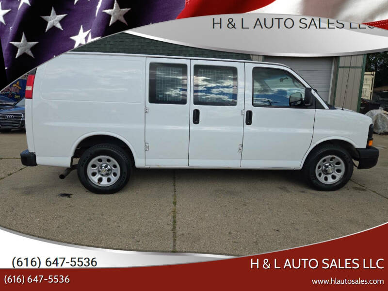 2014 Chevrolet Express for sale at H & L AUTO SALES LLC in Wyoming MI