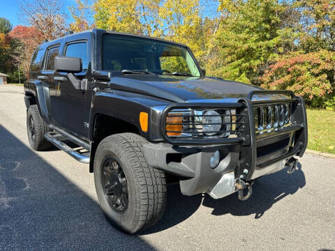 2009 HUMMER H3 for sale at Minnix Auto Sales LLC in Cuyahoga Falls OH