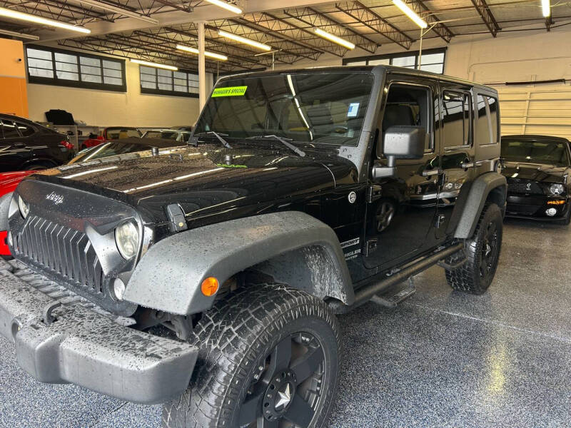 2014 Jeep Wrangler Unlimited for sale at MITCHELL MOTOR CARS in Pompano Beach FL