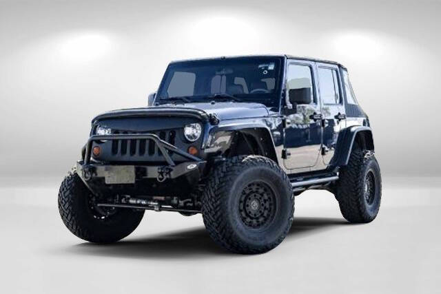2013 Jeep Wrangler Unlimited for sale at WOODLAKE MOTORS in Conroe TX